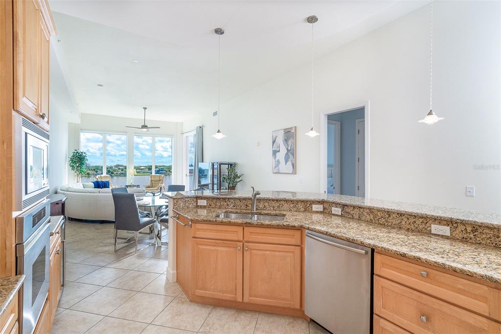1375 Beach Road, Unit 309 Englewood, FL 34223 - Photo 19 of 45 a spacious bathroom with a granite countertop sink and mirror