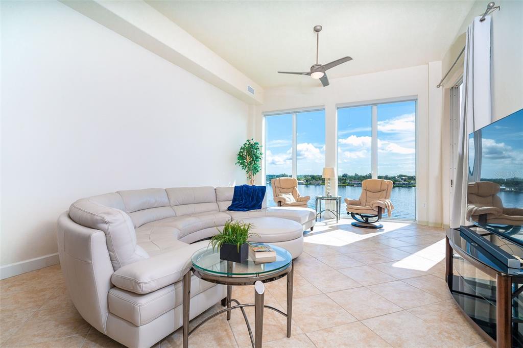 1375 Beach Road, Unit 309 Englewood, FL 34223 - Photo 22 of 45 a living room with furniture and a large window