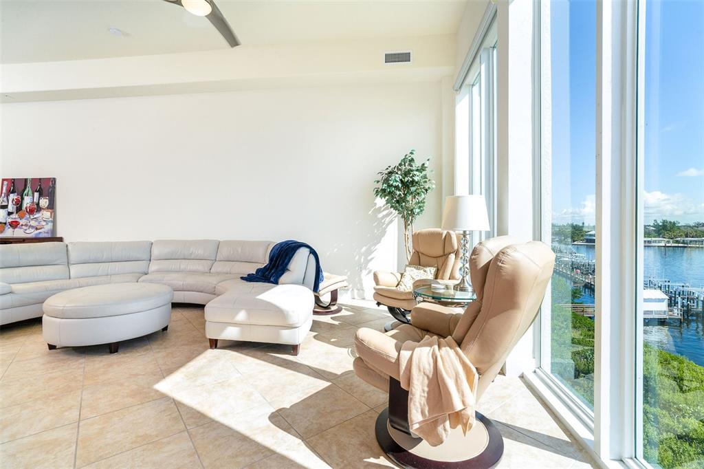 1375 Beach Road, Unit 309 Englewood, FL 34223 - Photo 23 of 45 a living room with furniture and a large window