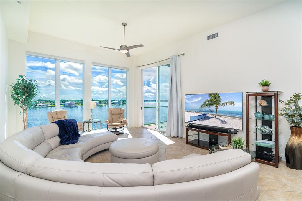 1375 Beach Road, Unit 309 Englewood, FL 34223 - Photo 25 of 45 a living room with furniture and a large window