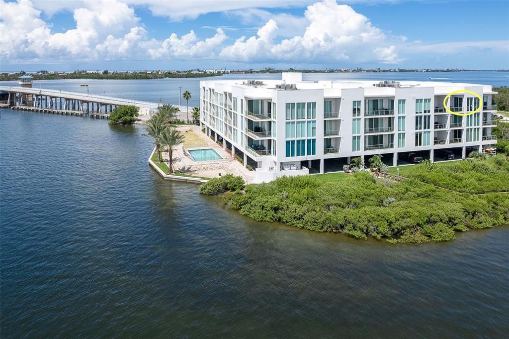1375 Beach Road, Unit 309 Englewood, FL 34223 - Photo 3 of 45 a view of a lake with building in front of it