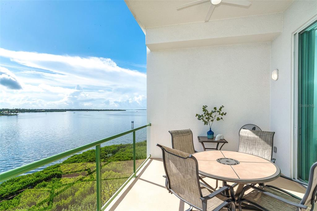 1375 Beach Road, Unit 309 Englewood, FL 34223 - Photo 31 of 45 a balcony with table and chairs