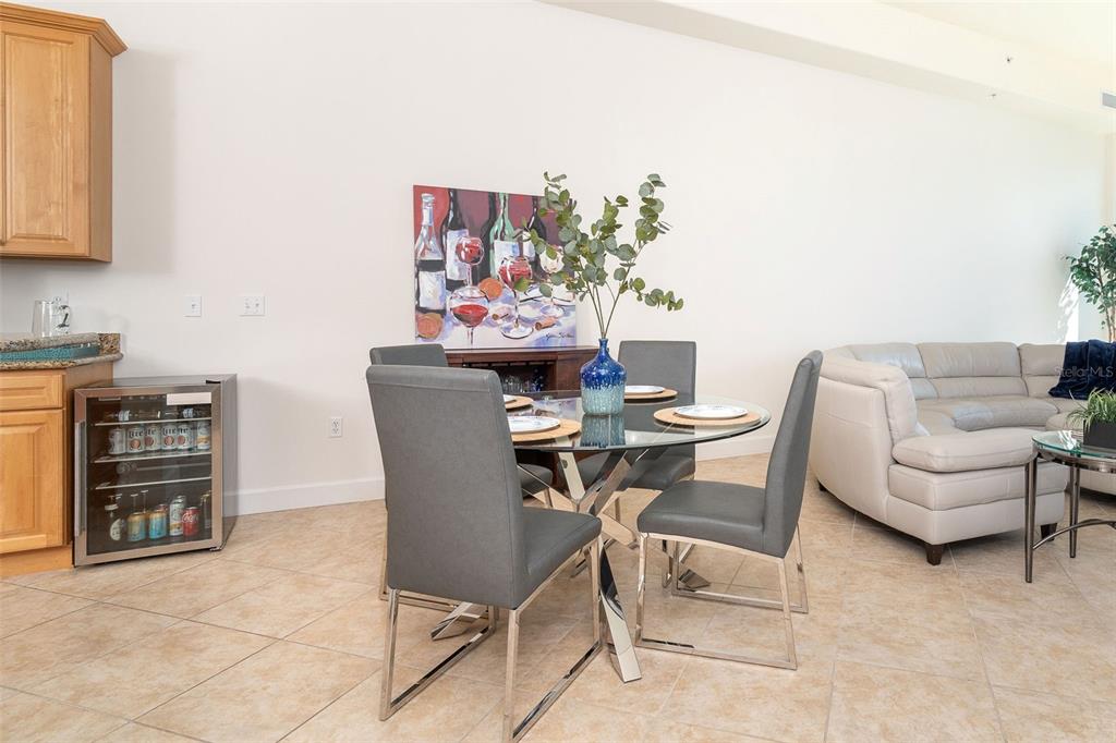 1375 Beach Road, Unit 309 Englewood, FL 34223 - Photo 36 of 45 a dining room with furniture and wooden floor