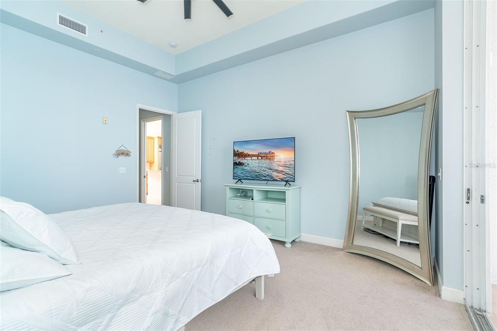 1375 Beach Road, Unit 309 Englewood, FL 34223 - Photo 39 of 45 a bedroom with a bed and a cabinets