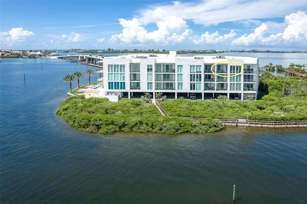 1375 Beach Road, Unit 309 Englewood, FL 34223 - Photo 4 of 45 a view of a building with a garden