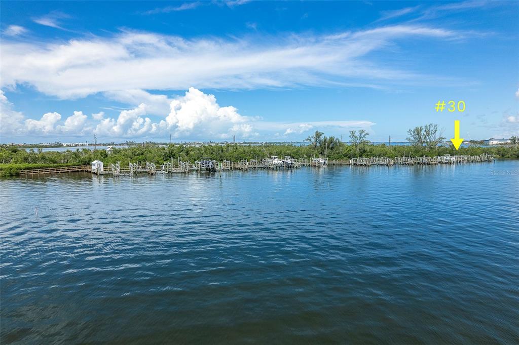 1375 Beach Road, Unit 309 Englewood, FL 34223 - Photo 44 of 45 a view of a lake with houses in the back