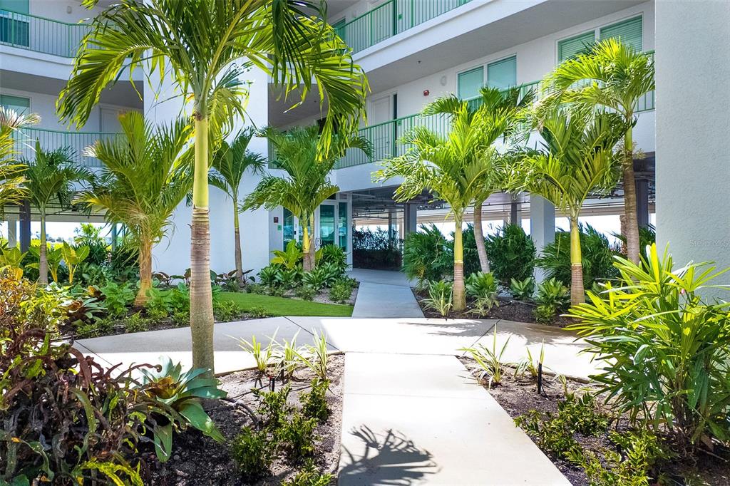 1375 Beach Road, Unit 309 Englewood, FL 34223 - Photo 6 of 45 a view of a garden with potted plants