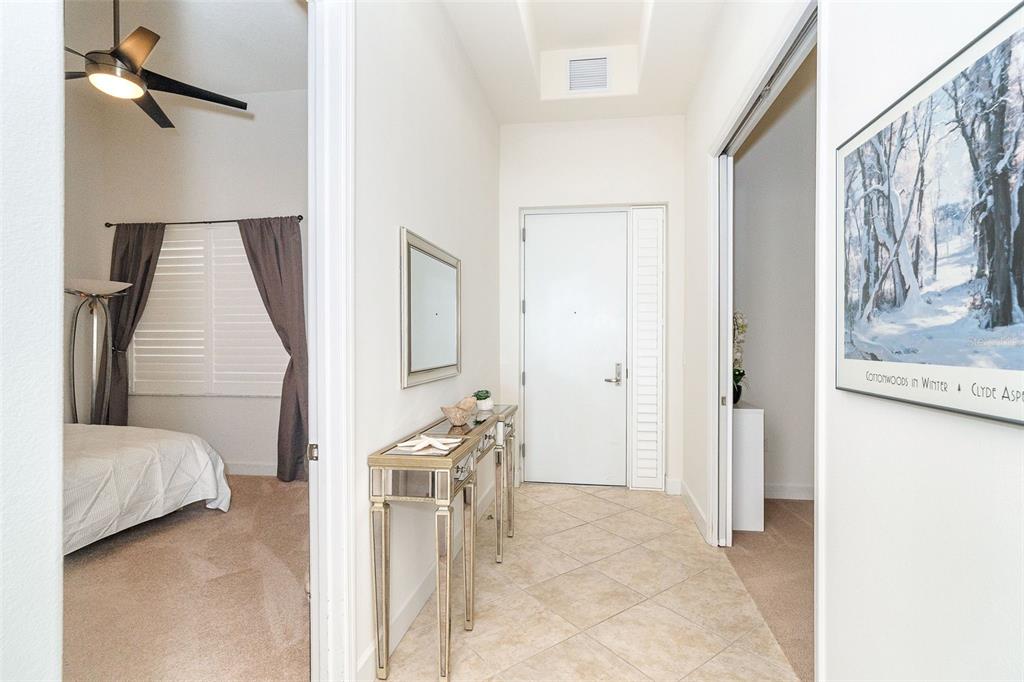 1375 Beach Road, Unit 309 Englewood, FL 34223 - Photo 8 of 45 a view of a bedroom with furniture and staircase