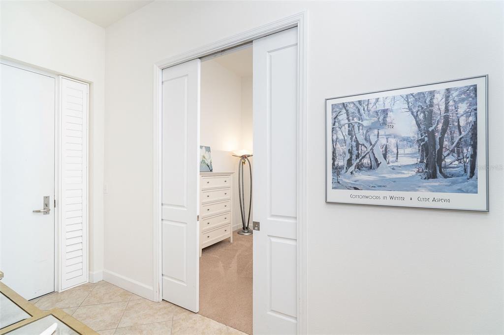 1375 Beach Road, Unit 309 Englewood, FL 34223 - Photo 9 of 45 a view of a hallway with paintings on the wall