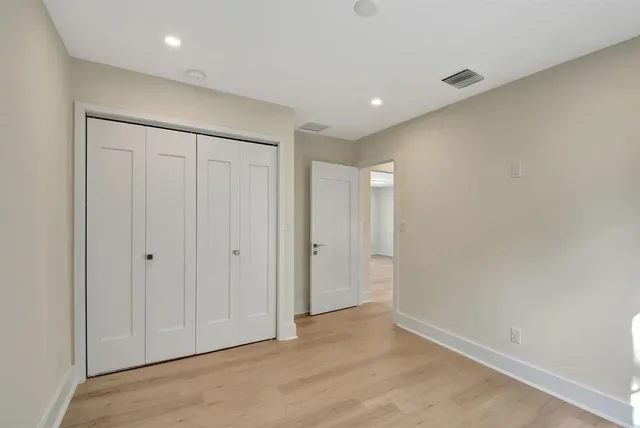 a view of an empty room with a garden