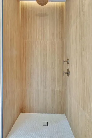 a view of a balcony with wooden floor and stairs