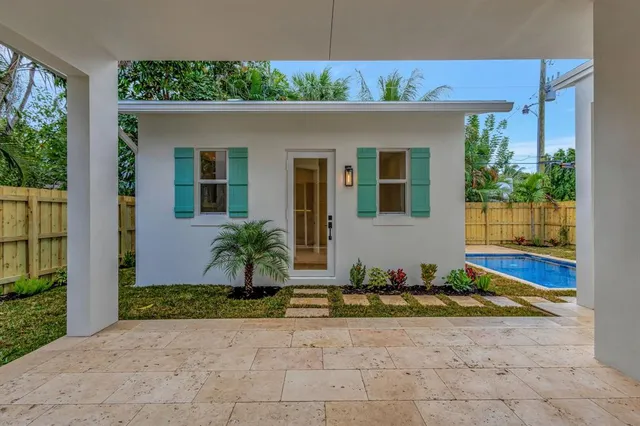 aerial view of a house with a yard and garden