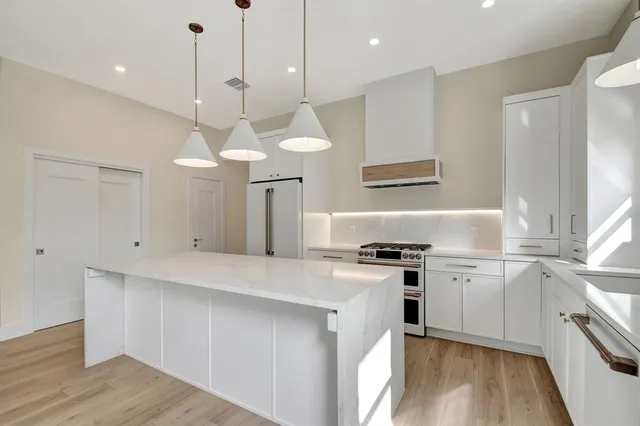 a kitchen with appliances and cabinets
