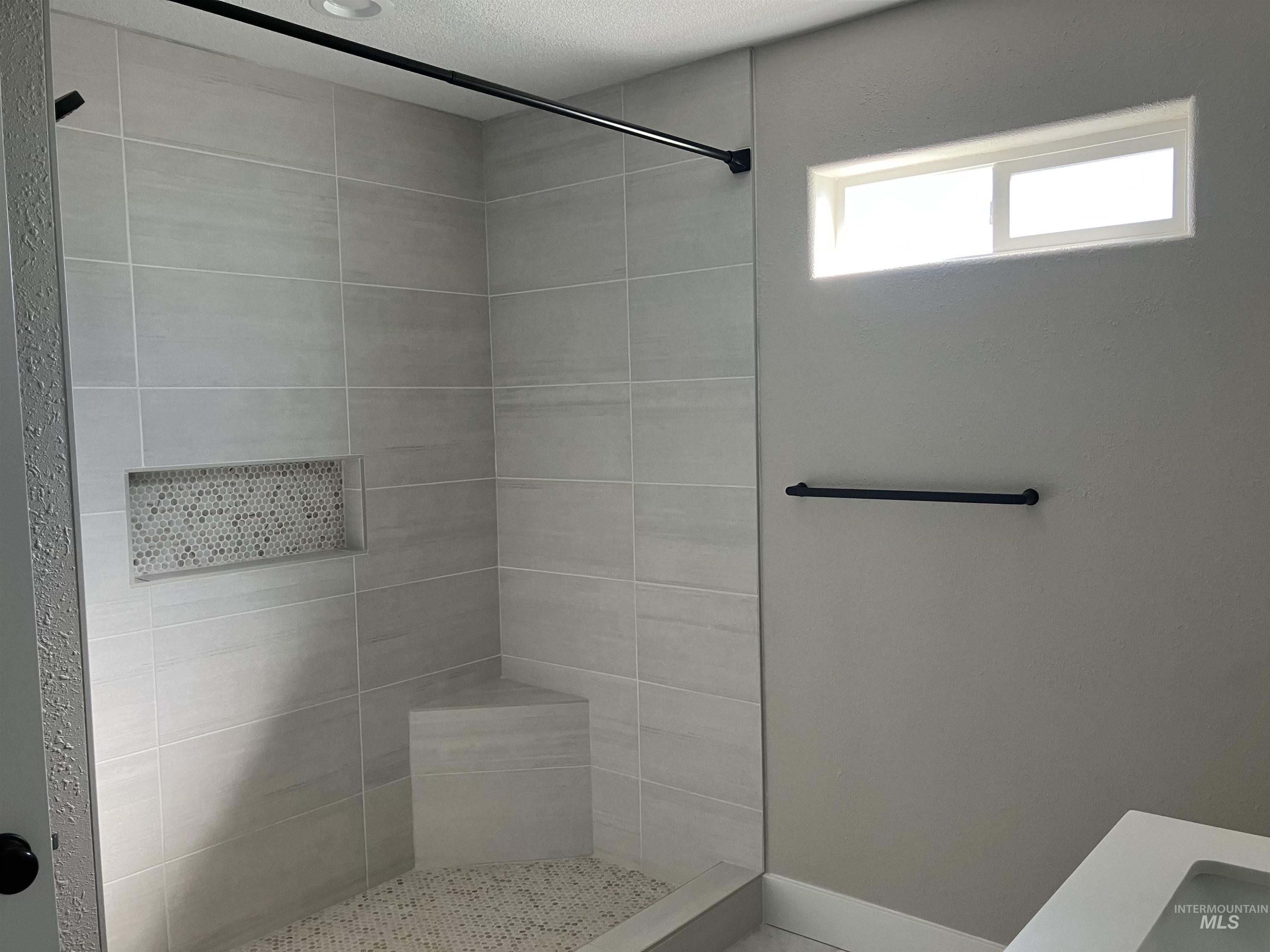 17530 Beet Road Caldwell, ID 83607 - Photo 22 of 50 Full bathroom featuring a stall shower and a textured ceiling