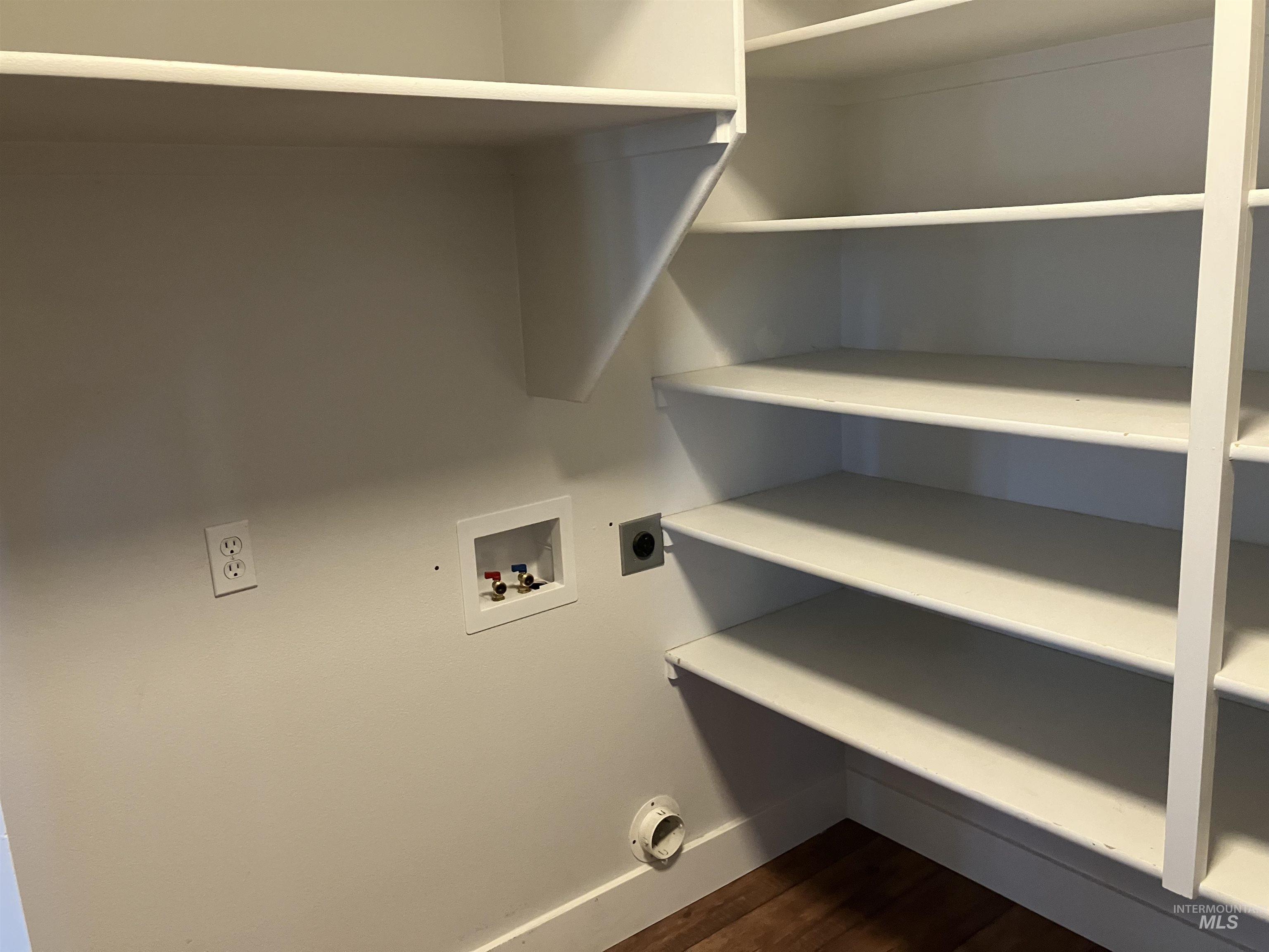 17530 Beet Road Caldwell, ID 83607 - Photo 30 of 50 Laundry room with hookup for a washing machine, hookup for an electric dryer, and dark wood-style floors