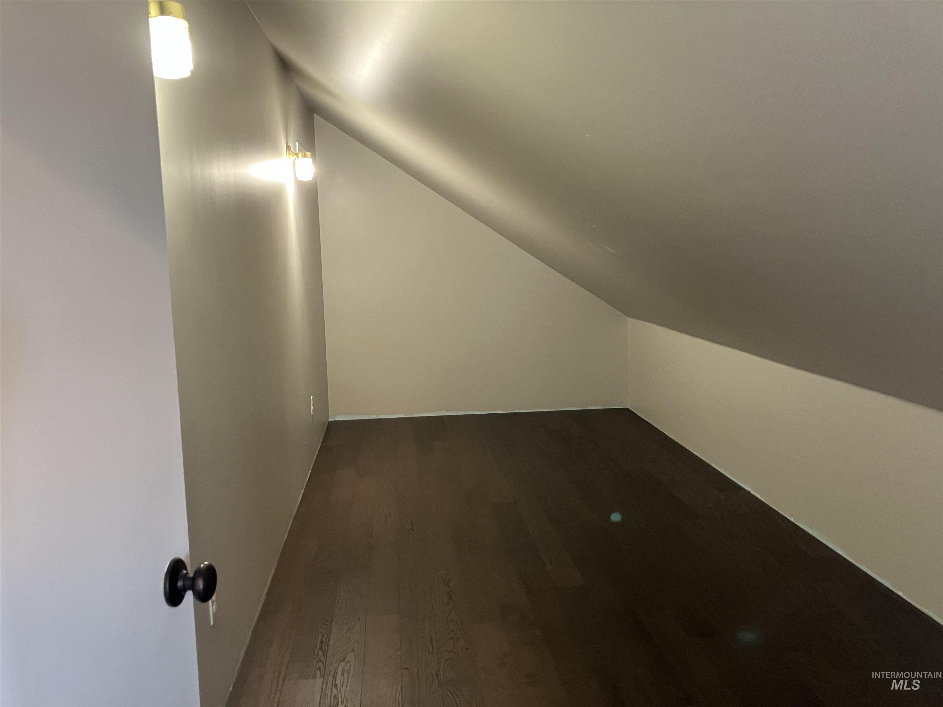 17530 Beet Road Caldwell, ID 83607 - Photo 38 of 50 Closet with dark wood-style flooring and lofted ceiling. Floor is 8' x 19'