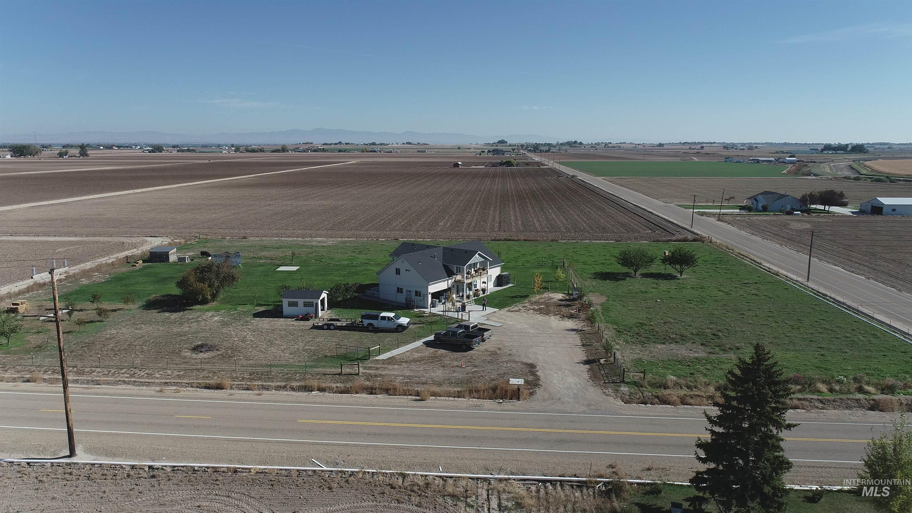 17530 Beet Road Caldwell, ID 83607 - Photo 48 of 50 Aerial view of sparsely populated area featuring rows of crops