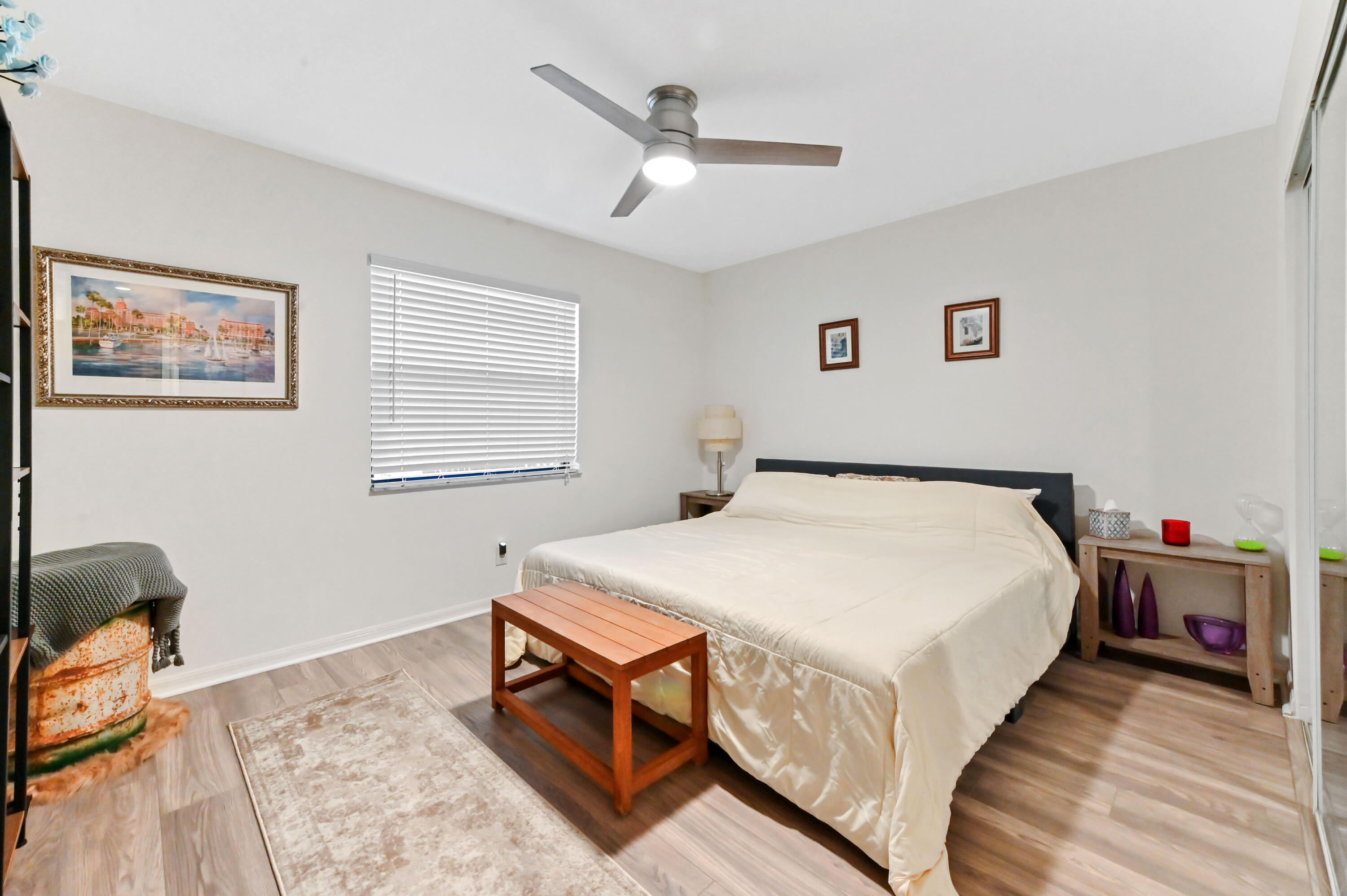 1230 Southeast Parkview Place, Unit D2 Stuart, FL 34994 - Photo 14 of 34 a bed room with a bed and a chair