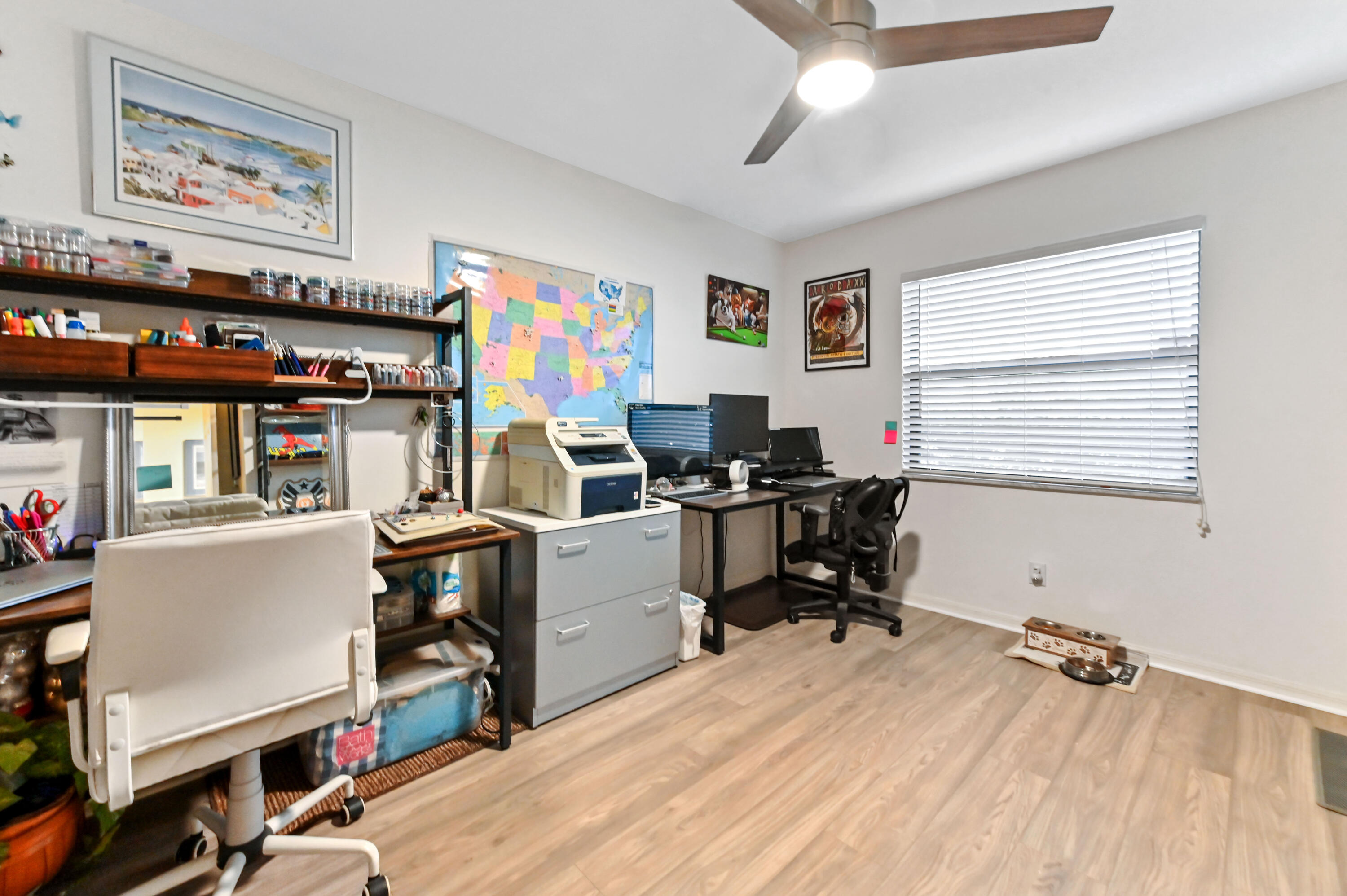 1230 Southeast Parkview Place, Unit D2 Stuart, FL 34994 - Photo 20 of 34 a view of a workspace with furniture and a window