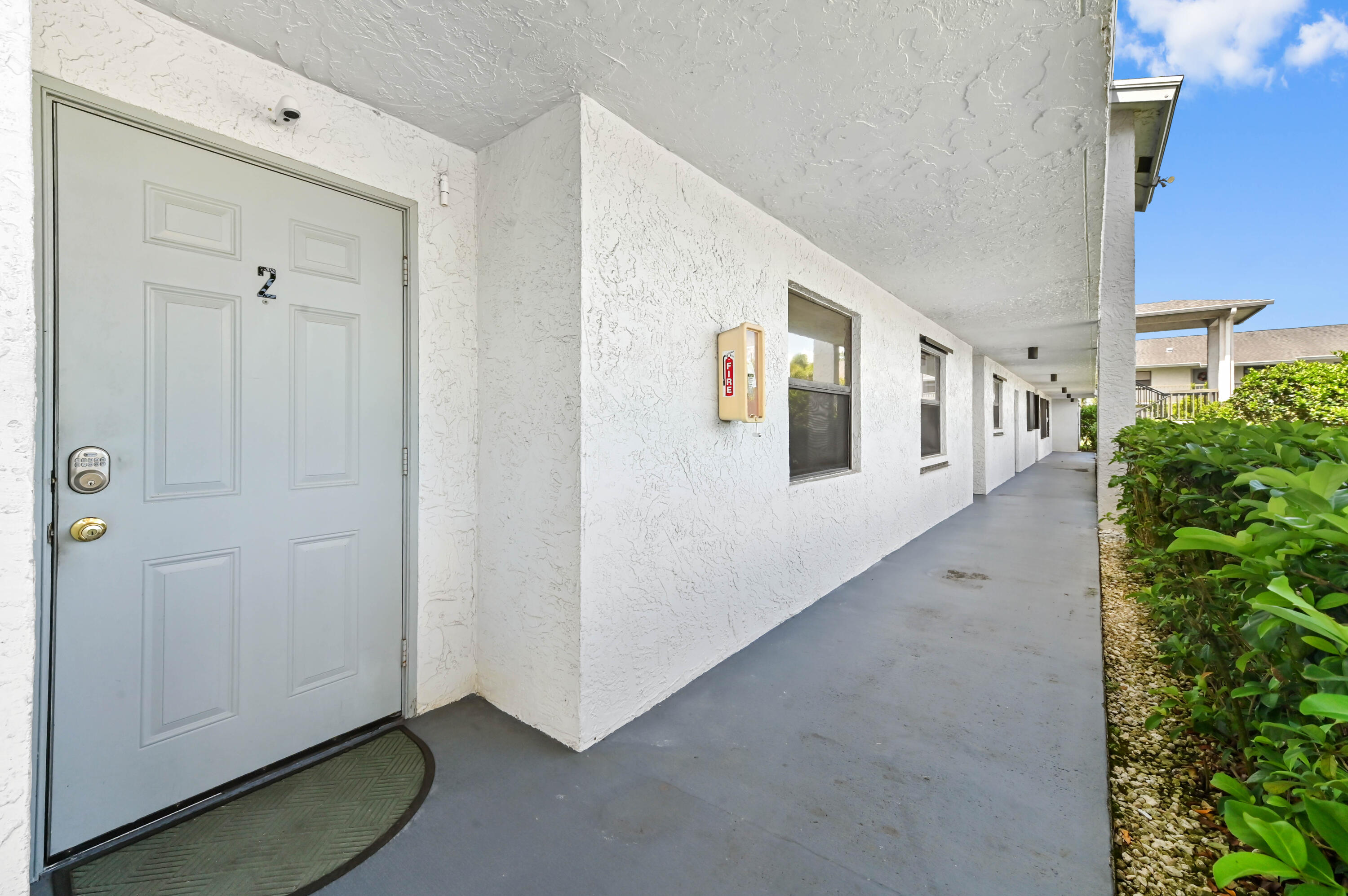 1230 Southeast Parkview Place, Unit D2 Stuart, FL 34994 - Photo 2 of 34 a view of a hallway with windows