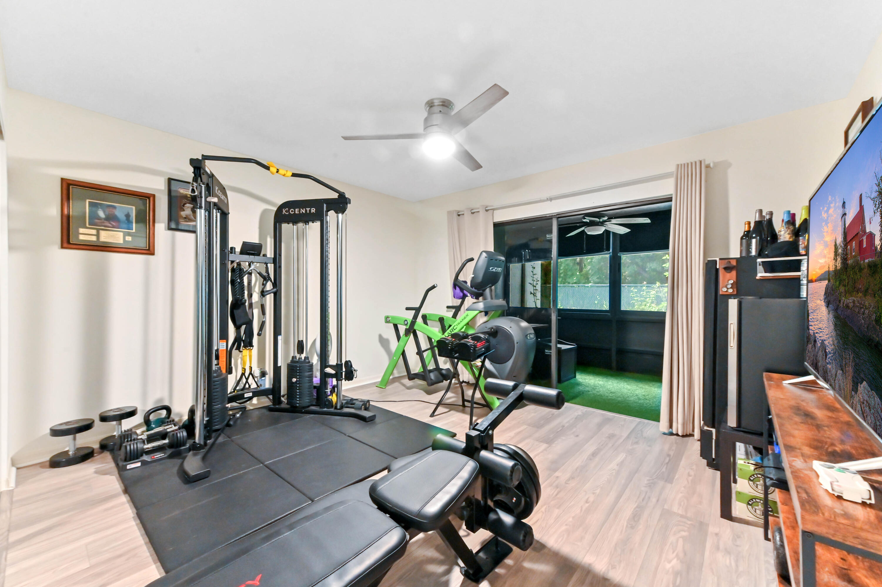 1230 Southeast Parkview Place, Unit D2 Stuart, FL 34994 - Photo 23 of 34 a view of a livingroom with furniture and floor to ceiling window