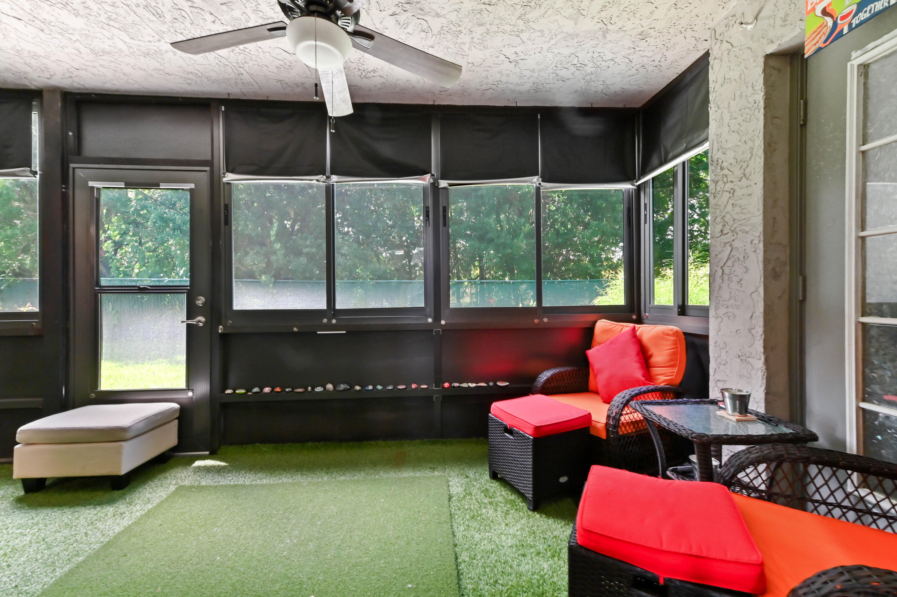 1230 Southeast Parkview Place, Unit D2 Stuart, FL 34994 - Photo 27 of 34 a living room with furniture and a floor to ceiling window