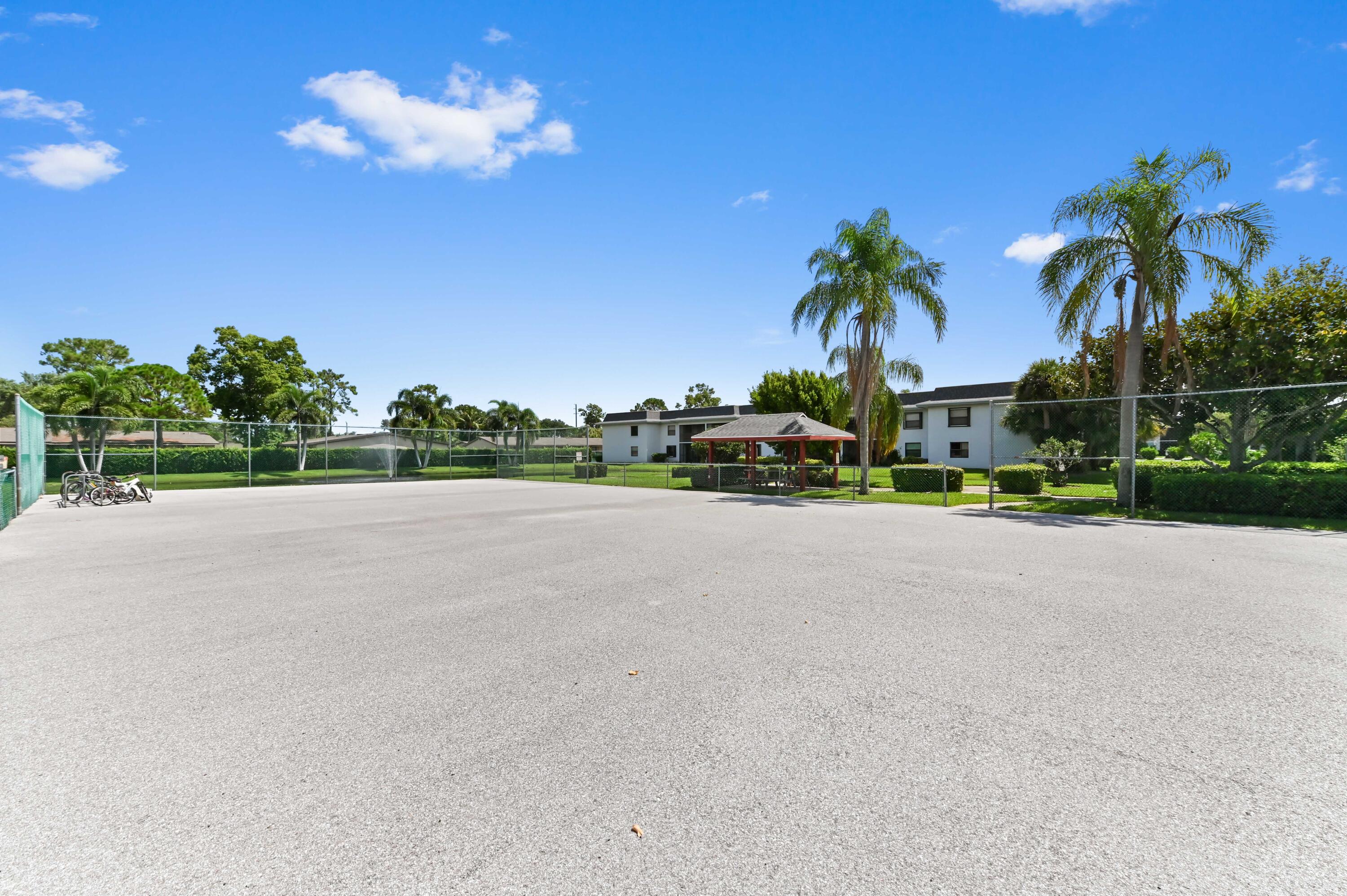 1230 Southeast Parkview Place, Unit D2 Stuart, FL 34994 - Photo 34 of 34 a view of a house with a street