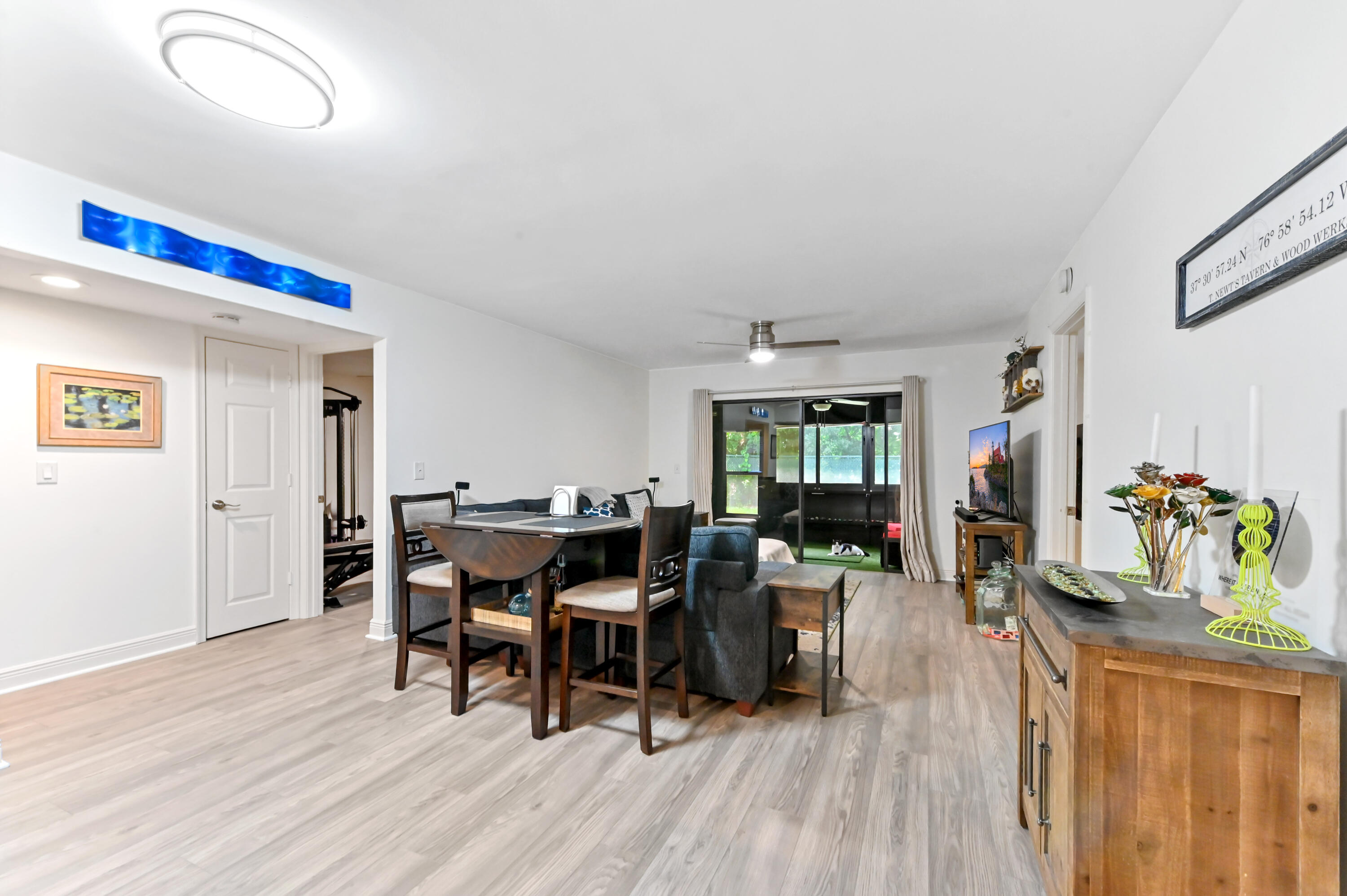 1230 Southeast Parkview Place, Unit D2 Stuart, FL 34994 - Photo 7 of 34 a view of a dining room with furniture window and wooden floor