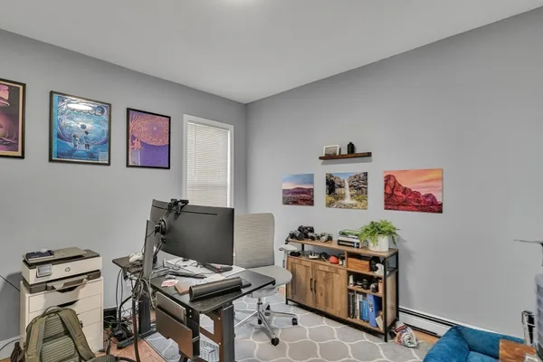 a room with furniture and wooden floor