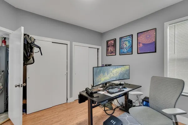 a view of a livingroom with furniture and a flat screen tv