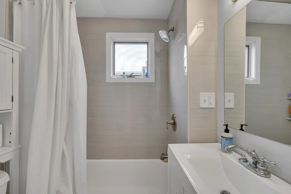 a bathroom with a sink and a bathtub