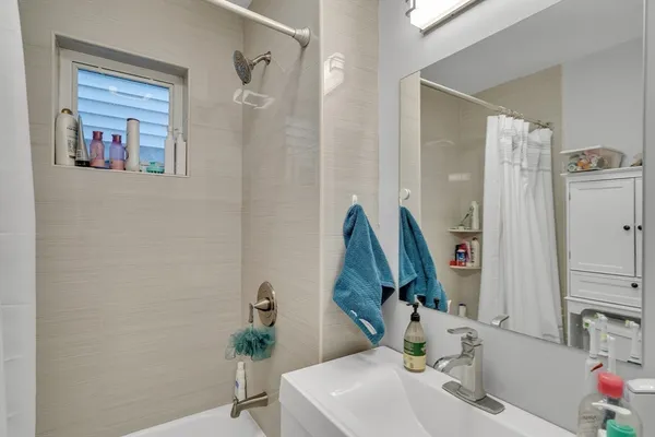 a bathroom with a sink and a mirror
