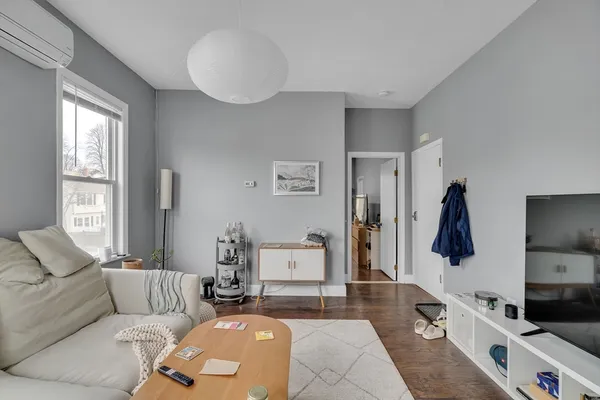 a living room with furniture and a window