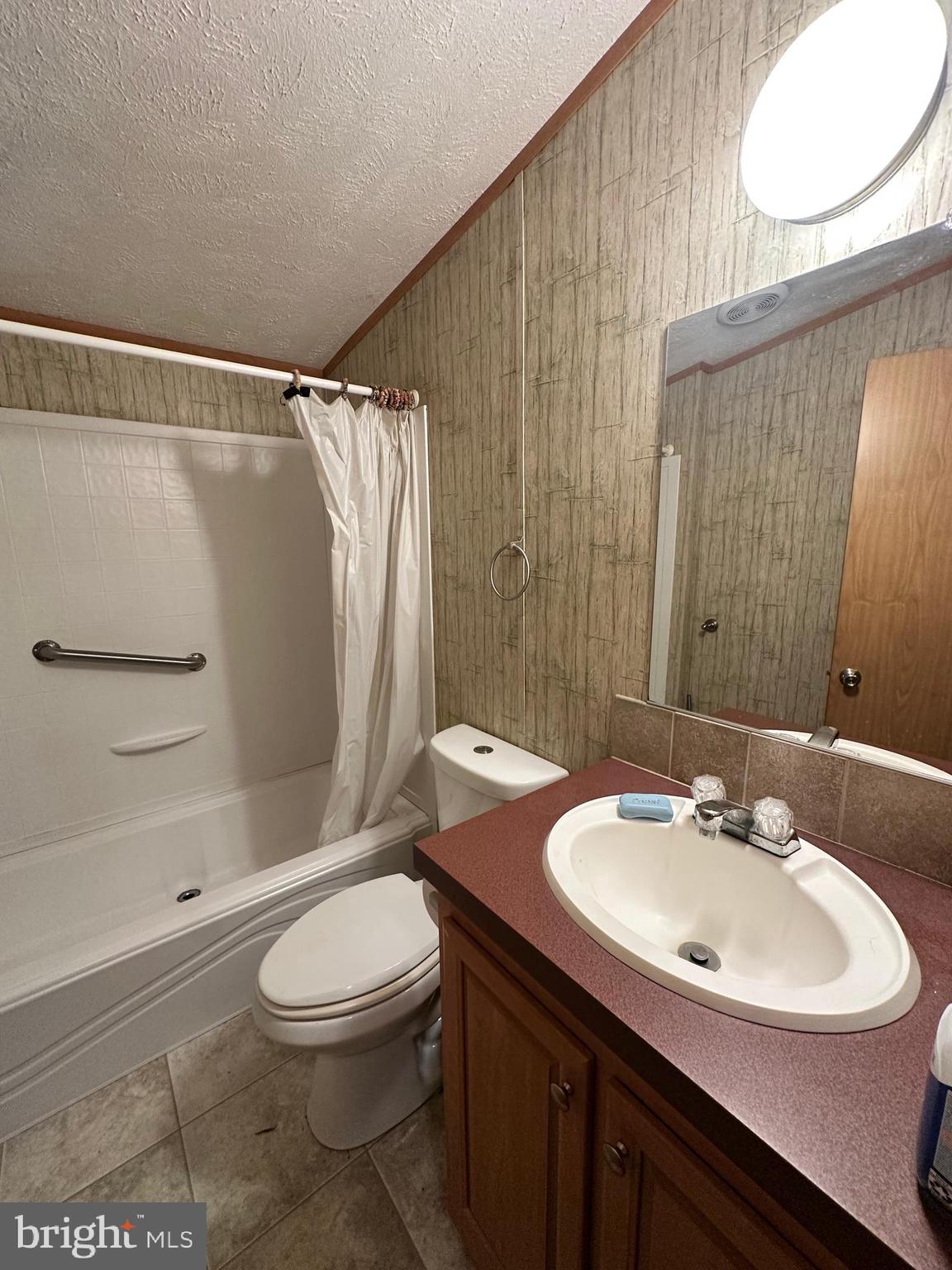 35390 Heron Road Millsboro, DE 19966 - Photo 16 of 25 a bathroom with a sink toilet and shower