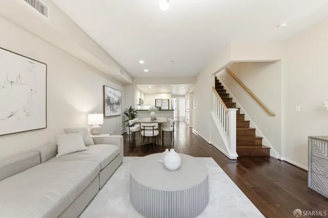 a view of a dining room with furniture wooden floor and a rug