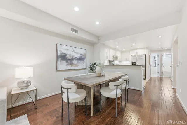 a kitchen with stainless steel appliances granite countertop a sink and cabinets
