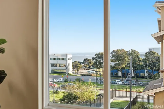 a bathroom with a sink a toilet and a large mirror
