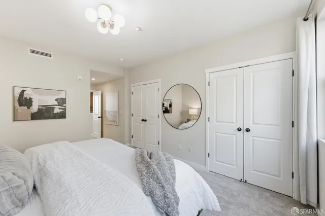 a bathroom with a double vanity sink mirror and shower