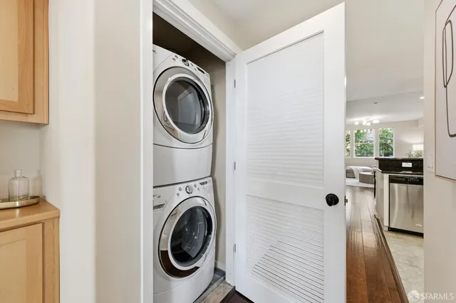 a view of an empty room with wooden roof and city