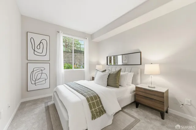 a bedroom with a bed and a couch