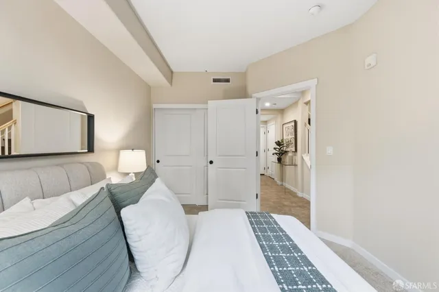 a bathroom with a toilet a sink a tub and mirror