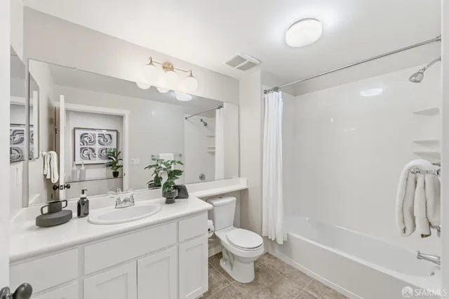 a kitchen with stainless steel appliances kitchen island granite countertop a stove top oven a sink a dining table and chairs