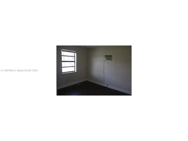 a picture of a room that has a window