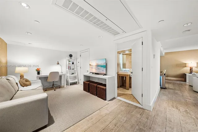 a view of kitchen island with furniture and wooden floor