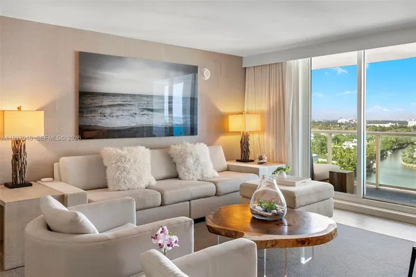 a living room with furniture and a large window