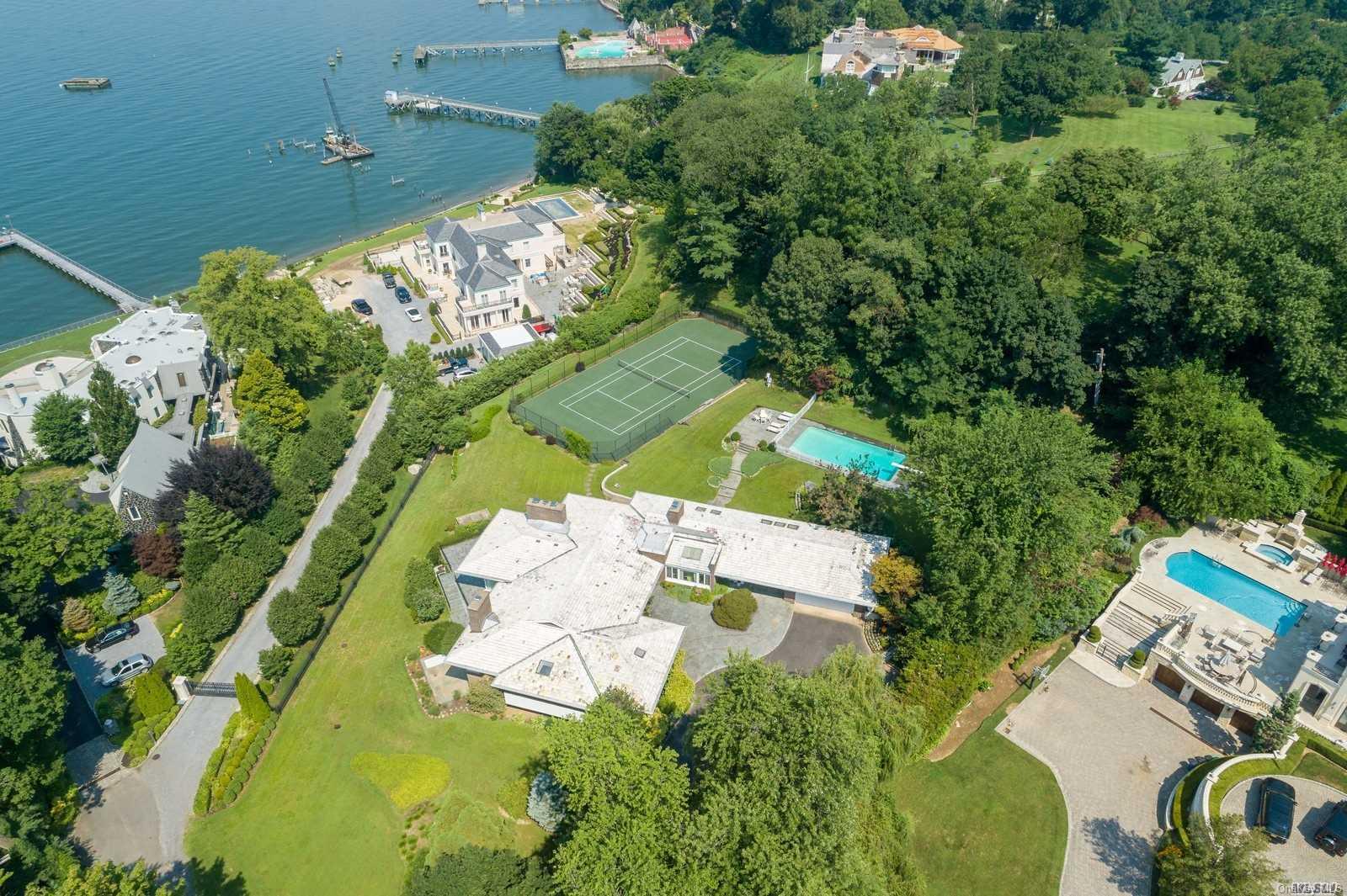 188 Kings Point Road Great Neck, NY 11024 - Photo 1 of 1 an aerial view of a house with a yard and lake view
