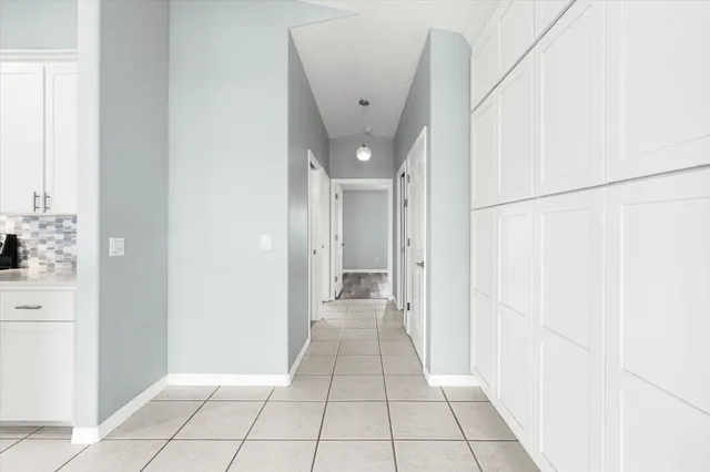 a kitchen with granite countertop a stove and a refrigerator