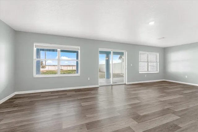a kitchen with a refrigerator sink and cabinets