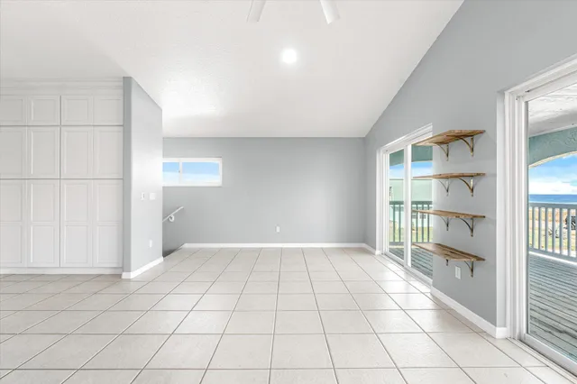 a view of kitchen with center island and stainless steel appliances