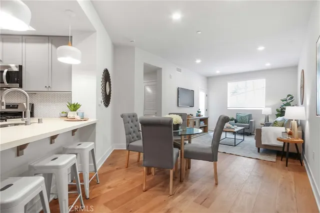 a view of a dining room with furniture and wooden floor